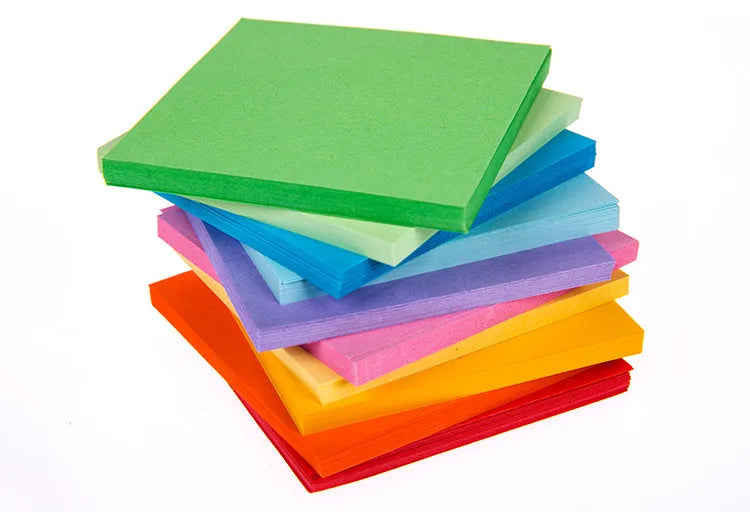 Colourful miniature paper scrolls for drift bottle messages with central eyelet for string attachment