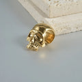 Close-up of personalised stainless steel hollow skull Buddha earrings in hip-hop style.