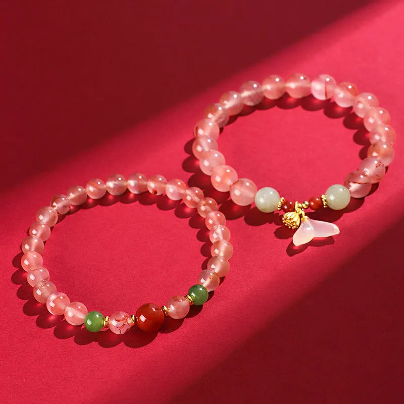 Women's ice floating south red white agate fishtail bracelet showing natural stone colour variation and textured design