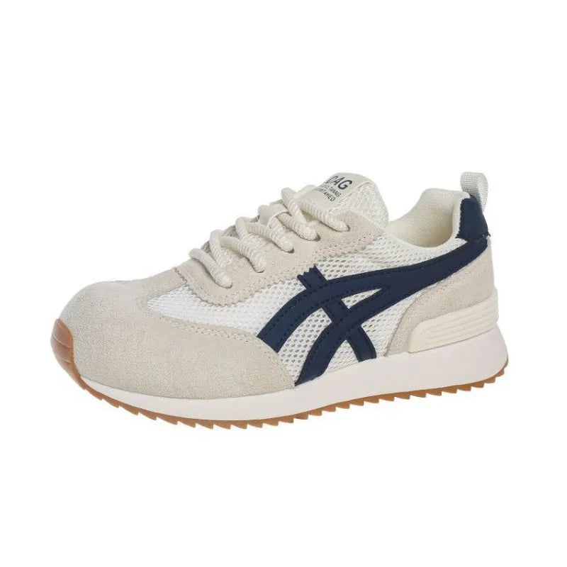 Women's white casual lace-up sneaker with non-slip sole on neutral background