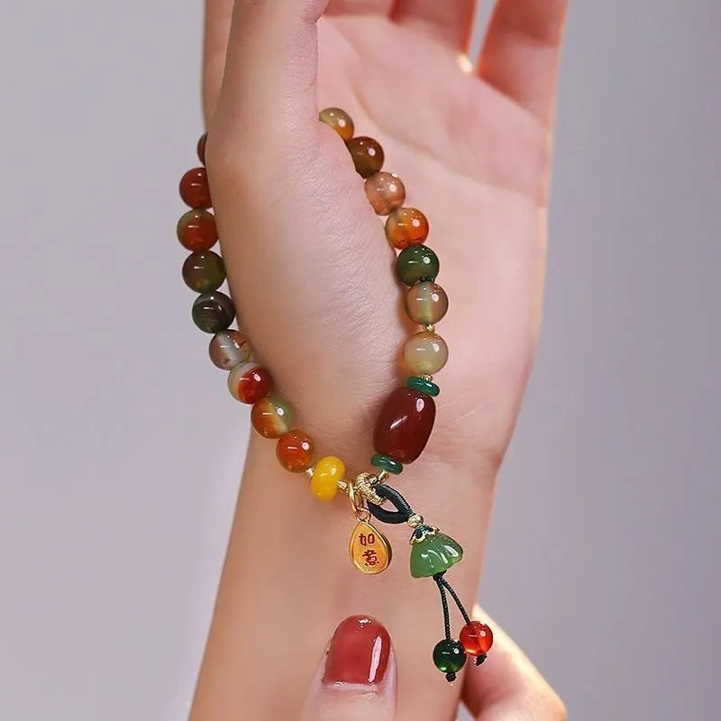 M990 Lotus Ruyi bracelet showing mixed material construction and lotus motif with manual craft details