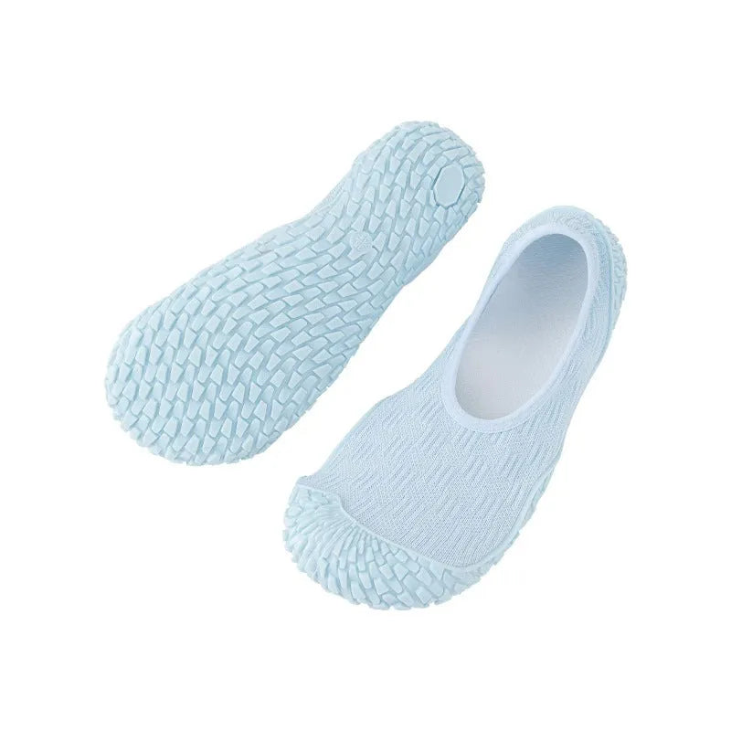 Women's low-top indoor fitness shoe in beige with a soft rubber sole and mesh lining.