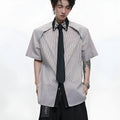 Men's blue and khaki loose fit shirt with diamond tie and patchwork striped pattern.