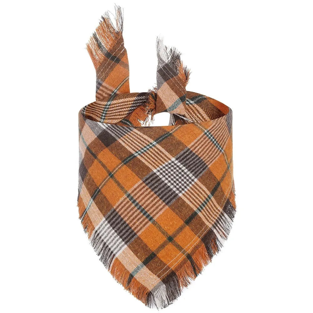 Plaid triangle dog bandana with tassels in autumn colours like orange and brown