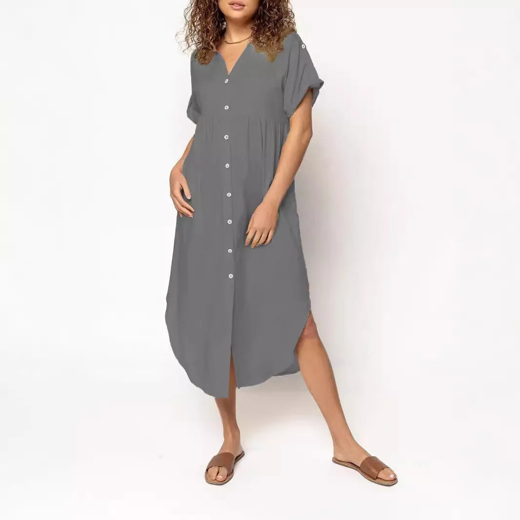 A loose fit, solid colour midi dress with a button front detail, shown in one of eight available colour options.