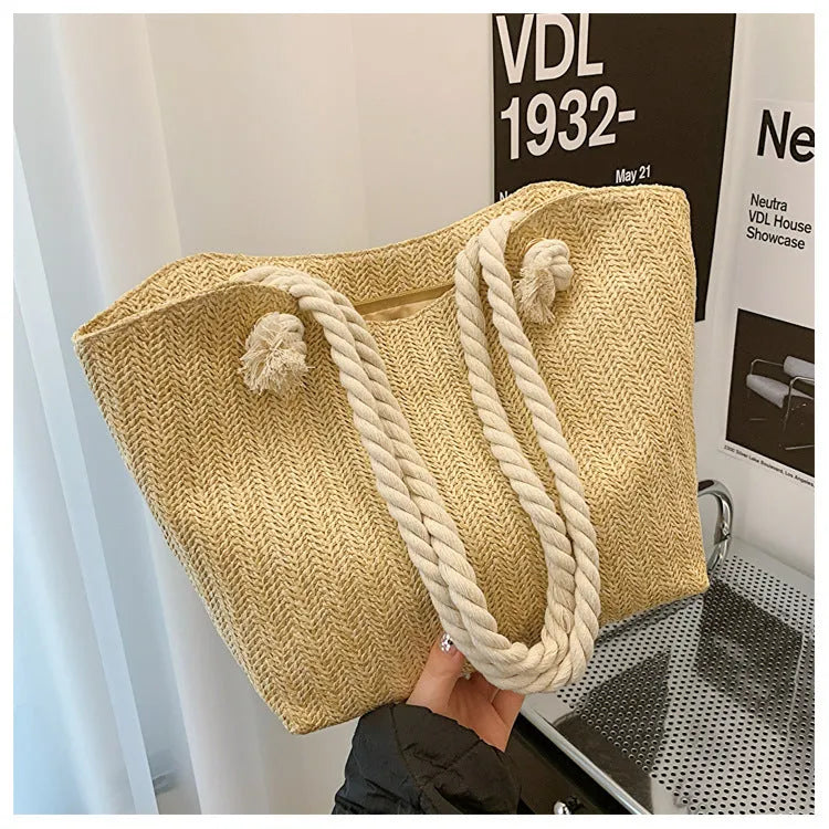 Women's straw shoulder handbag in white or khaki with clamshell opening, single strap, and phone bag