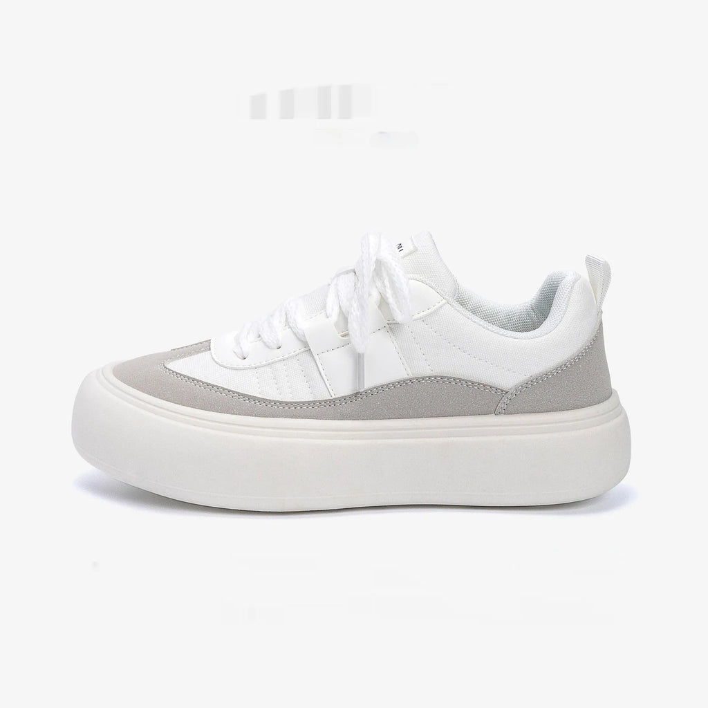 Men's black canvas platform sneakers with round toe and lace-up front on grey background