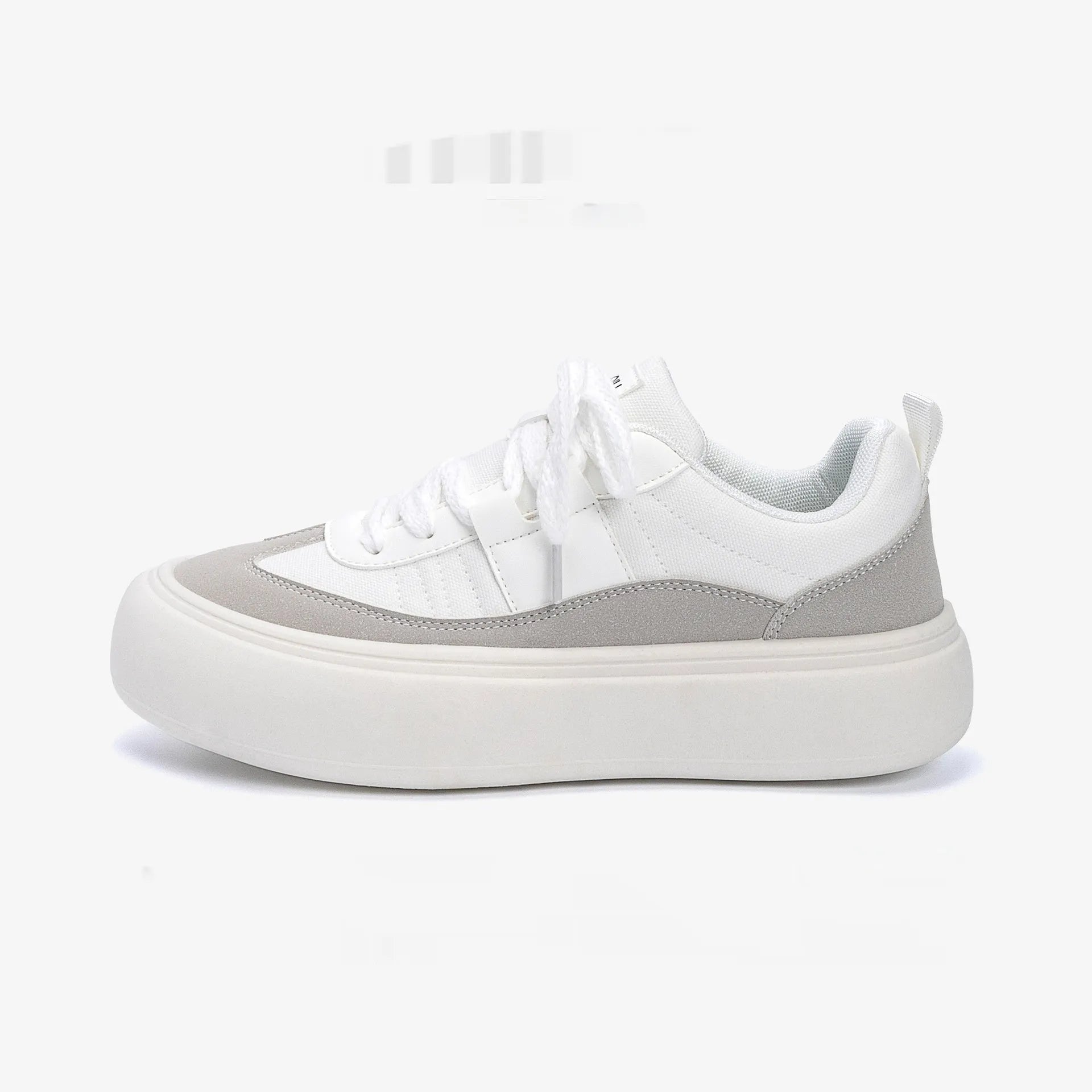 Men's black canvas platform sneakers with round toe and lace-up front on grey background
