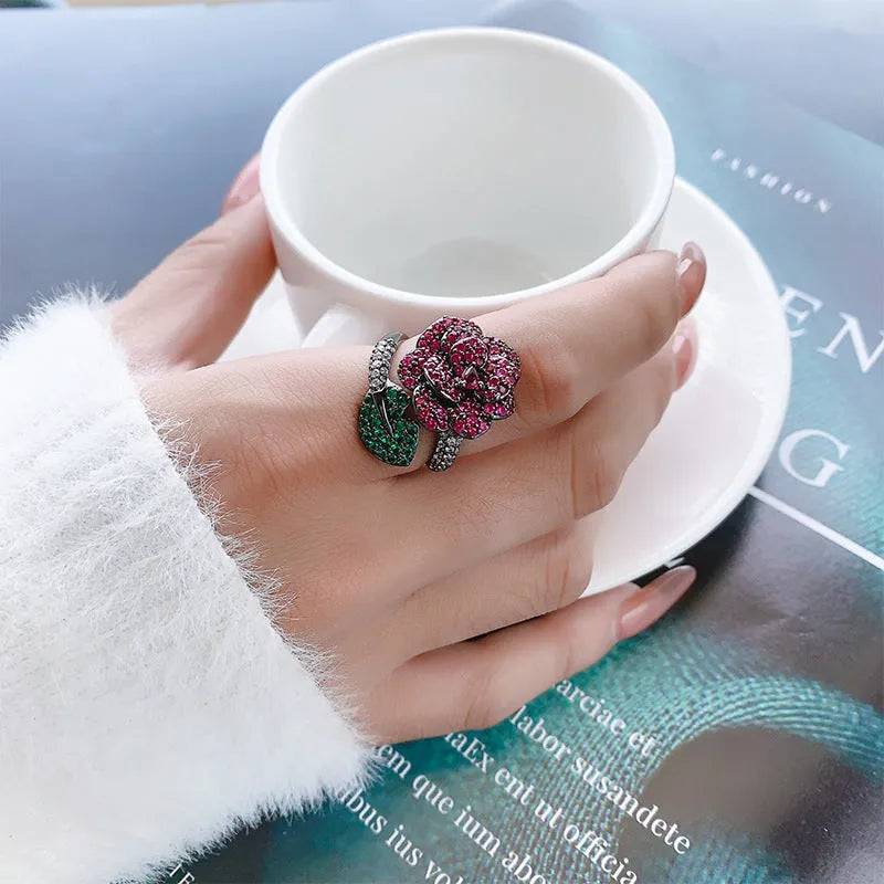 Geometric flower personality ring with gold-plated copper construction and red corundum centrepiece