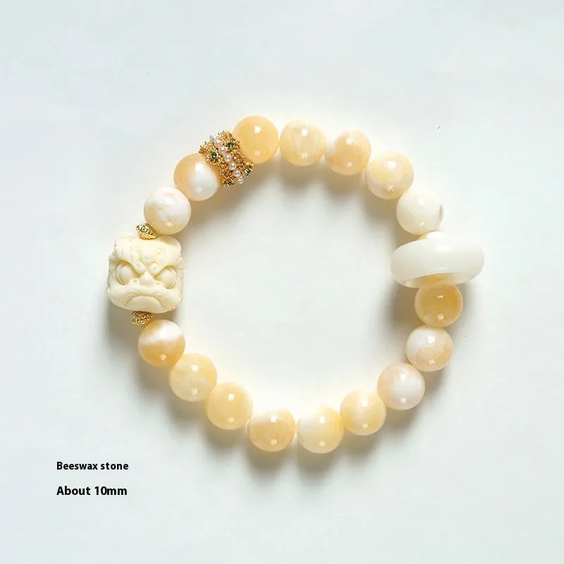 Hand-woven grey agate bracelet with ivory and mellite beads in a millet grain pattern