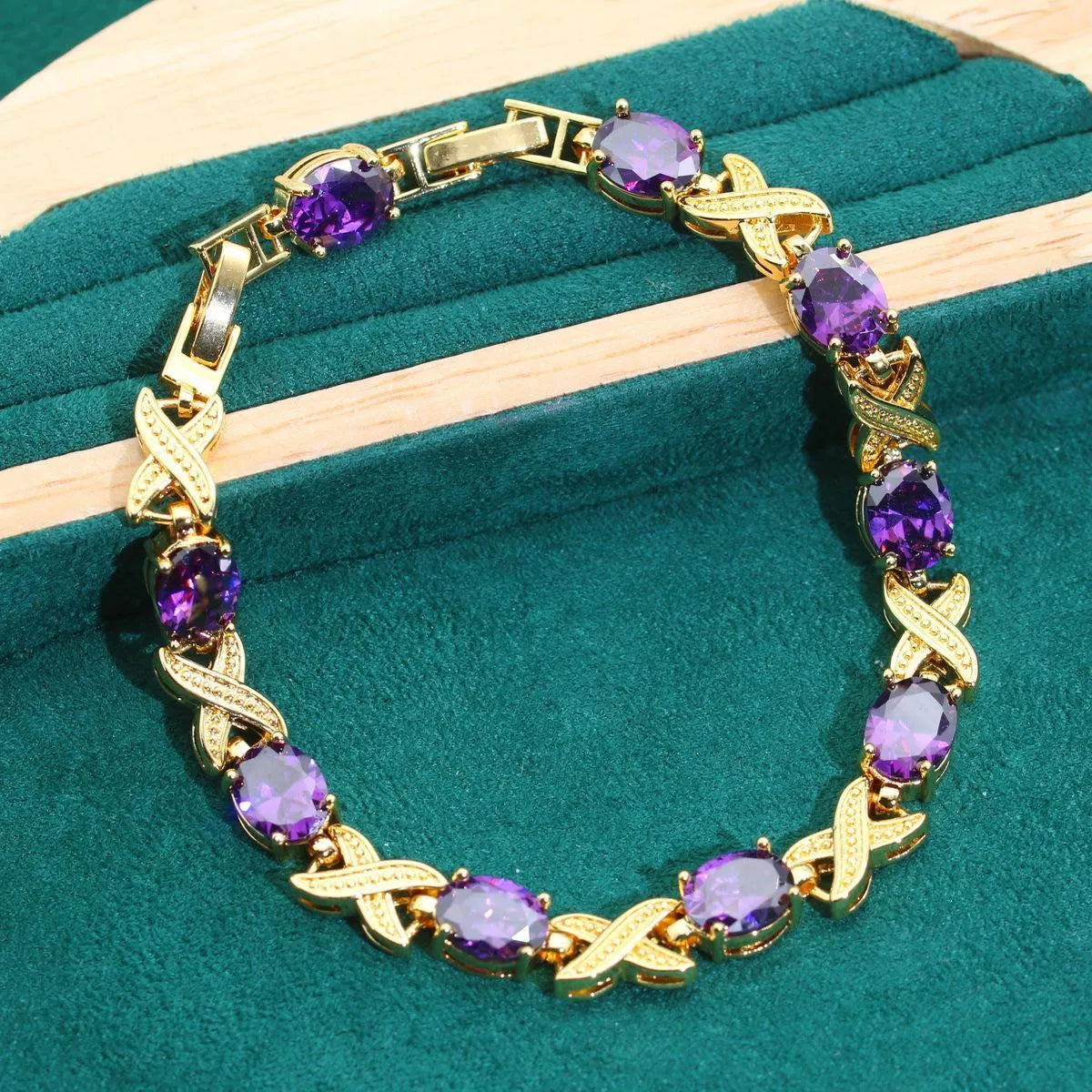 18k gold-plated necklace, earrings, ring, and bracelet set with colourful Raytheon-cut cubic zirconia stones.