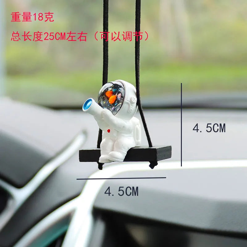 Cartoon style resin astronaut car pendant in five different colour and design variants.