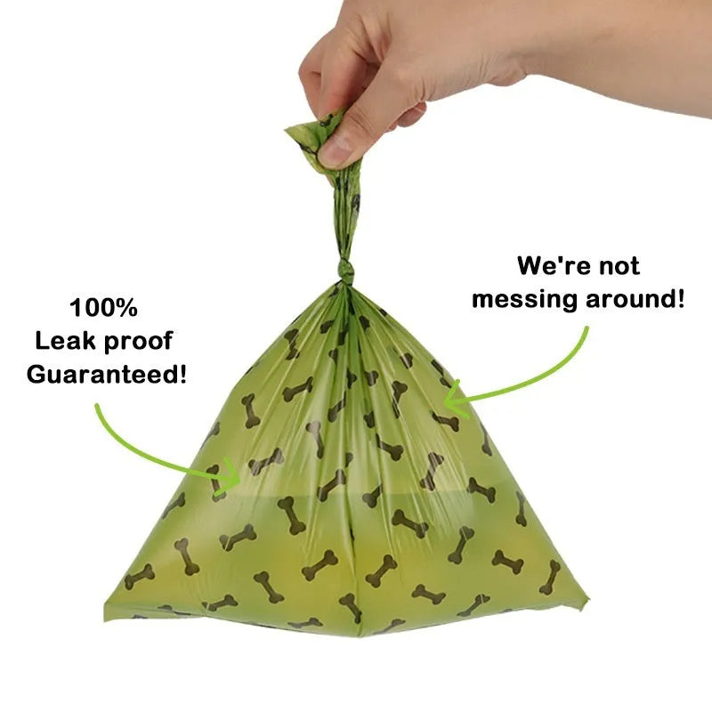 Roll of military green degradable dog poop bags with black bone print, showing bag size of 23x33cm.