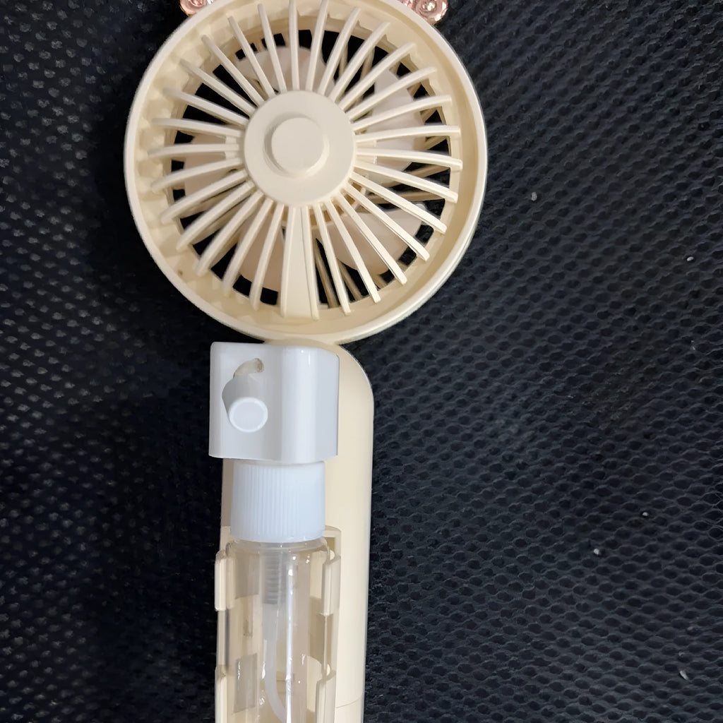 USB personal desk fan with plastic nozzle in five colour options on a desk