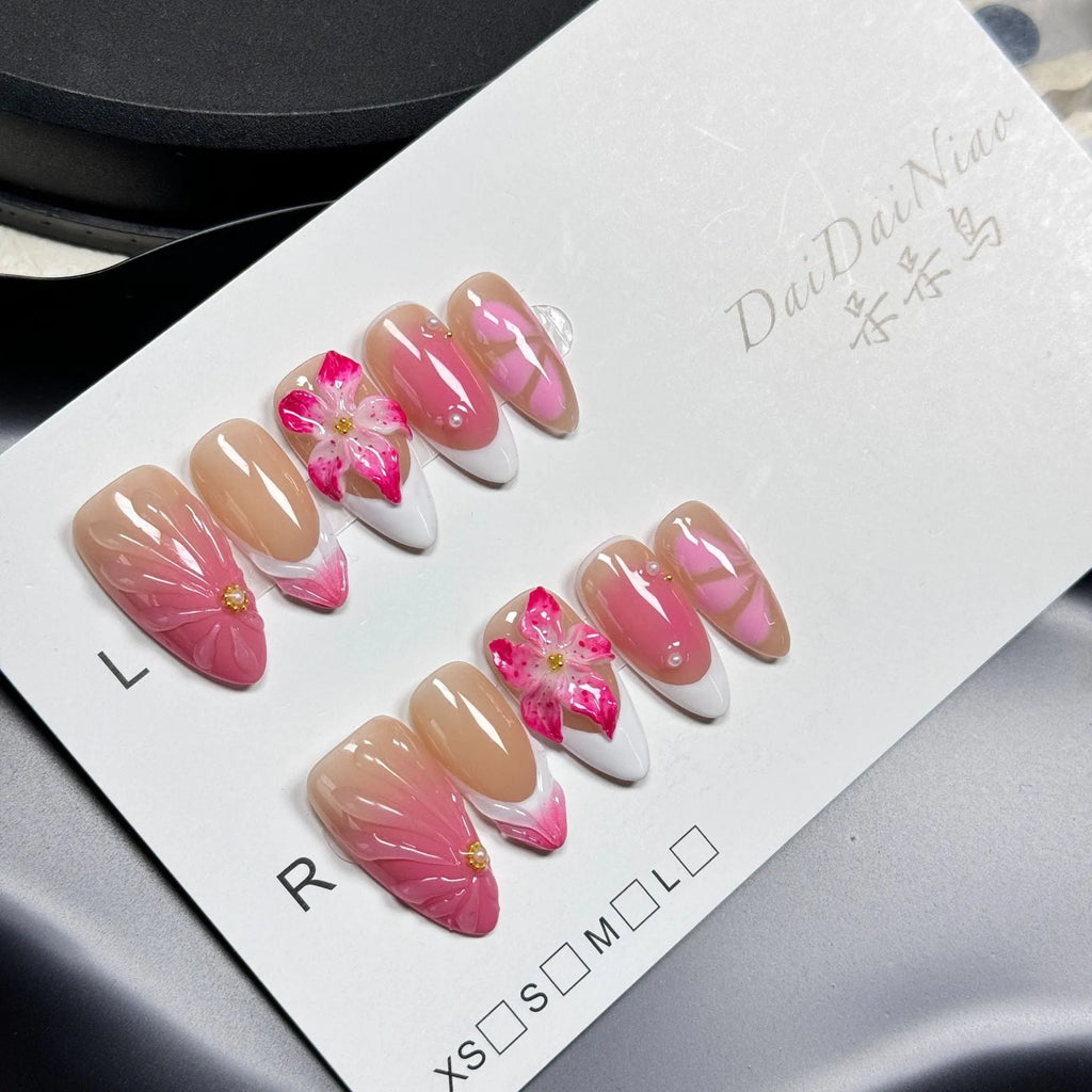 3D French style lily and ice flower plastic nail decoration in almond shape on a nail.