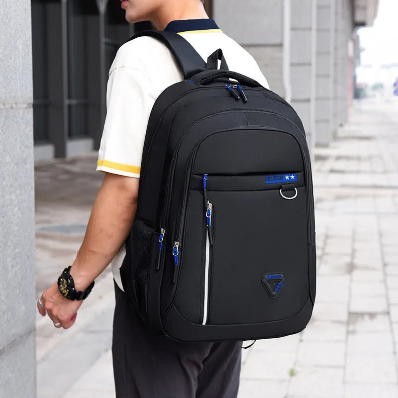 Men's Oxford cloth schoolbag in red with letter pattern design showing air pillow belt system