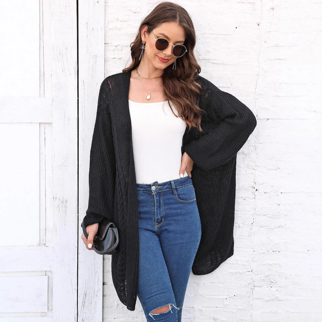 Brown loose-fitting acrylic sweater coat for women on a hanger.