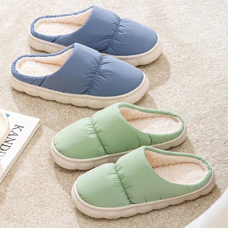 Blue down cotton winter slippers with thick rubber sole and plush lining for indoor use.