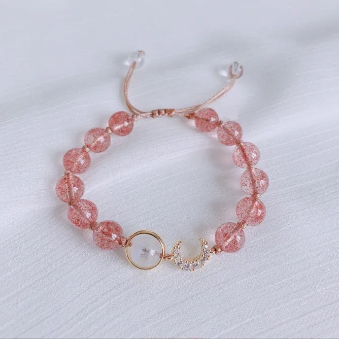 Handmade strawberry quartz crystal bracelet for women showing green strawberry quartz moon design.