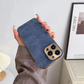 Slim grey leather texture TPU phone case for iPhone showing raised bezel around screen and camera.