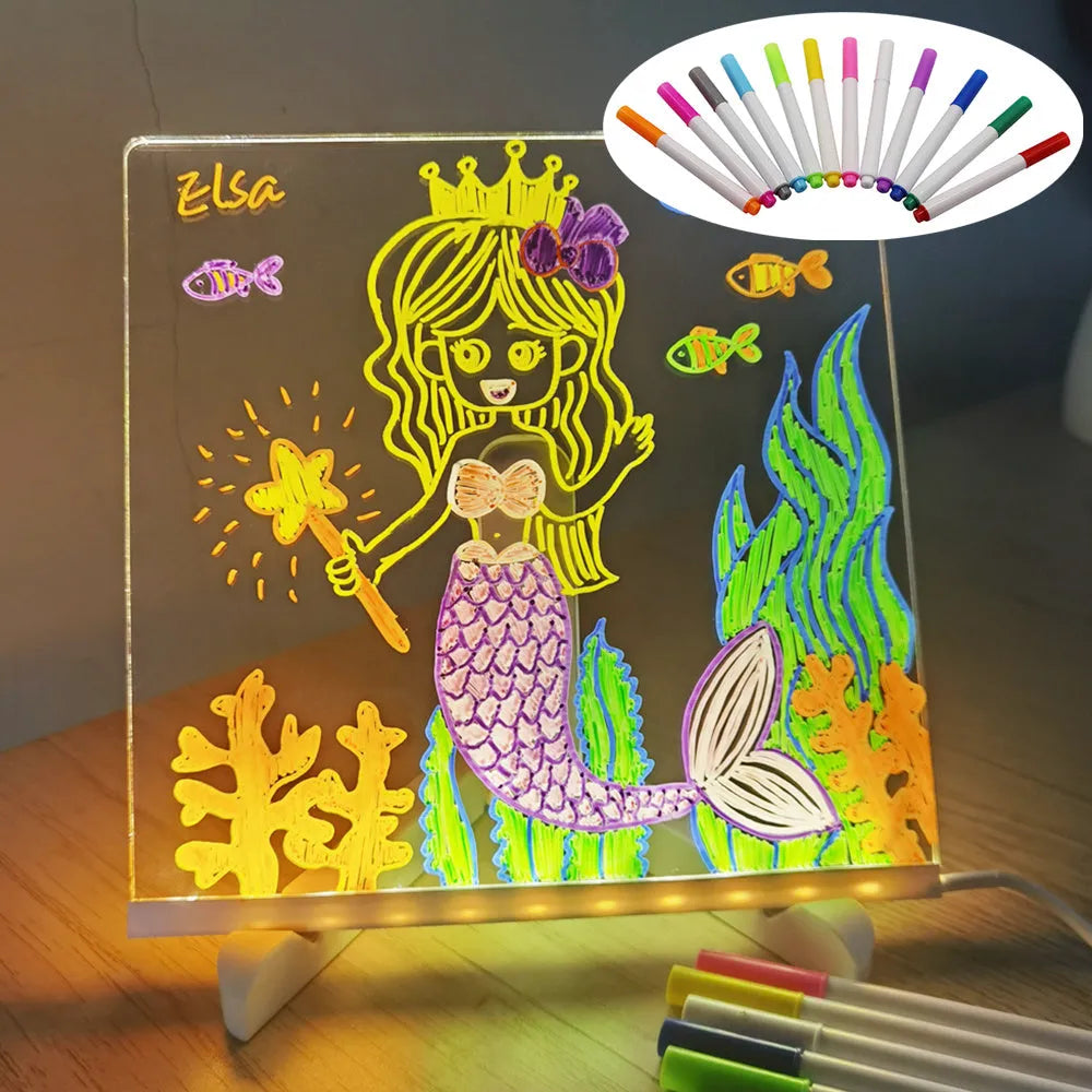Acrylic DIY LED message board on a bracket, glowing softly with handwritten notes, alongside white and colourful pens.