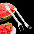 Stainless steel watermelon slicer and fork tool on a kitchen counter