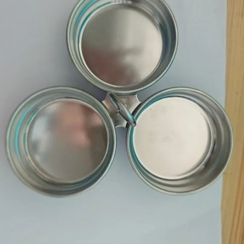Mini heart-shaped stainless steel egg steamer for cooking a single egg.