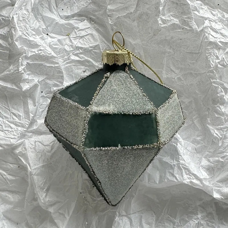 Handmade glass Christmas bauble 8cm diameter in green on branch