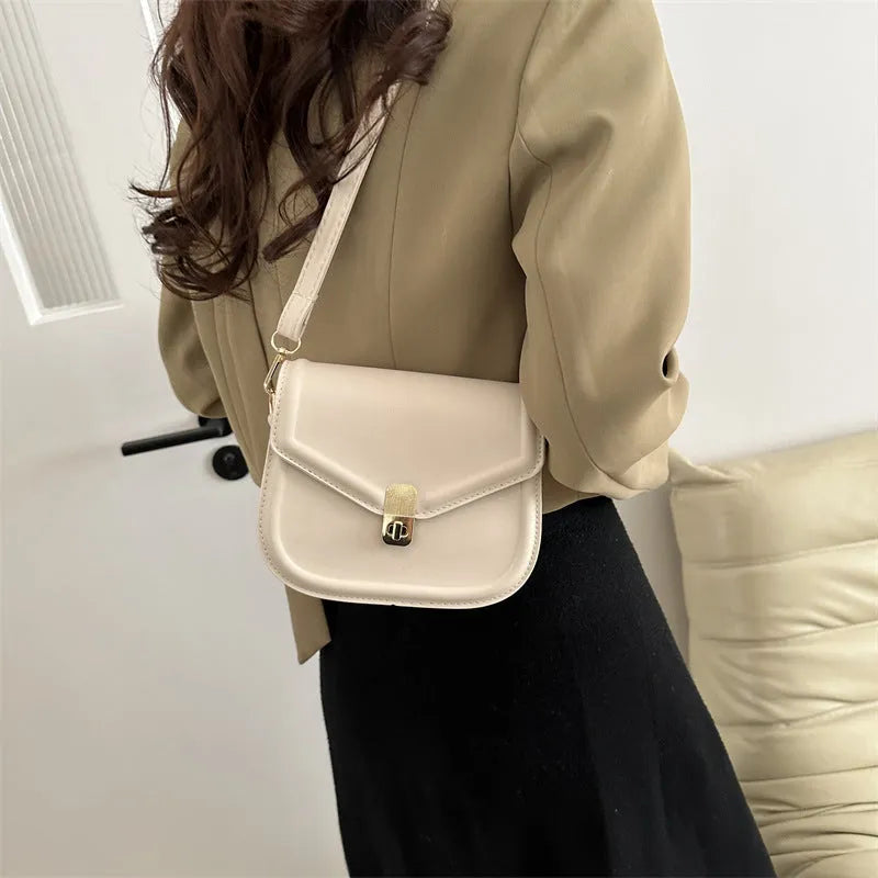 Soft PU clamshell messenger bag in horizontal square shape on a shoulder strap.
