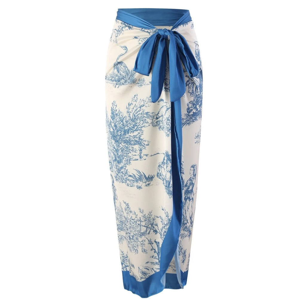 Blue patterned women's one-piece swimsuit with matching gauze skirt shown in multiple size options