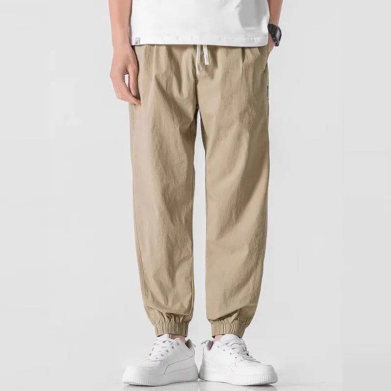 Men's fashion loose cuffed cargo pants in khaki, polyester fabric, autumn casual trousers with cuffed hem