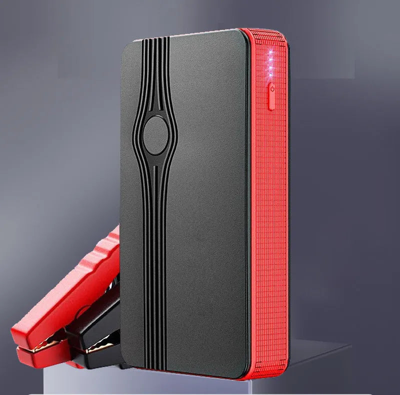 Compact red K4-E car jump starter and power bank with USB port and display.