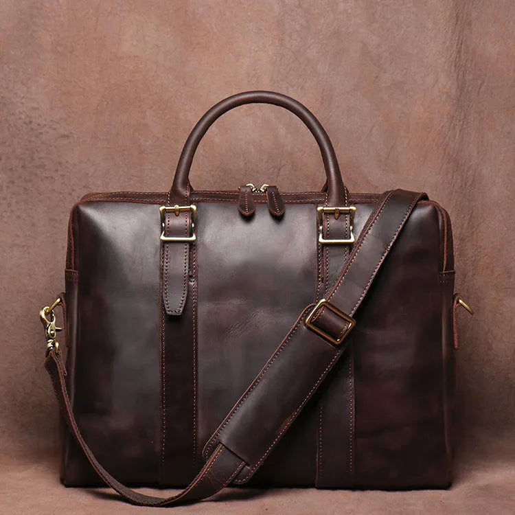 Men's large brown cow leather vintage handbag with zip closure, handle, shoulder strap, and 15 inch laptop space