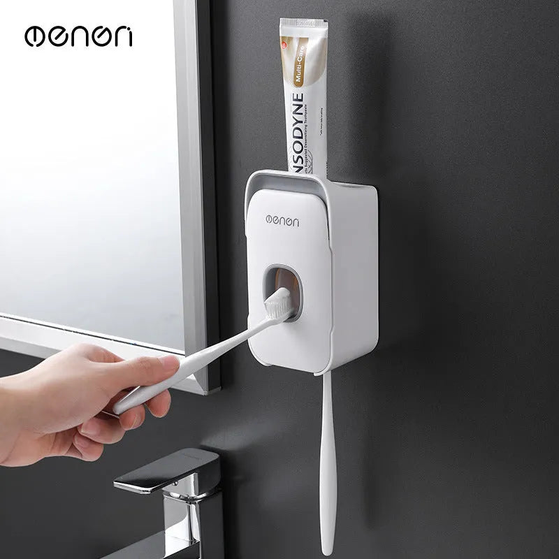 Automatic toothpaste dispenser in blue colour mounted on a bathroom wall