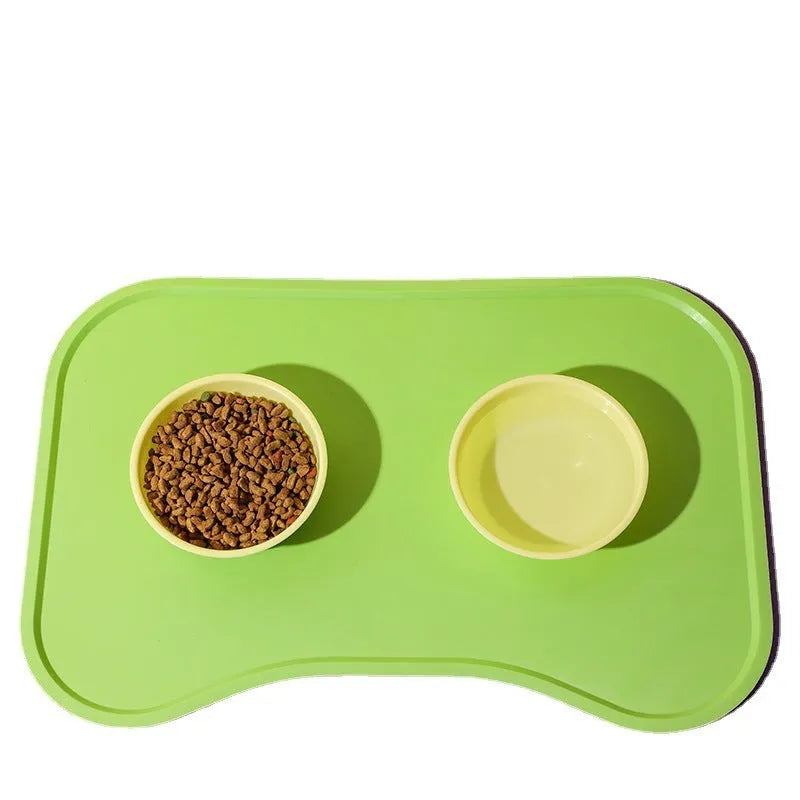 Waterproof silicone dog food mat with raised edges in green colour, non-slip base for pet bowls