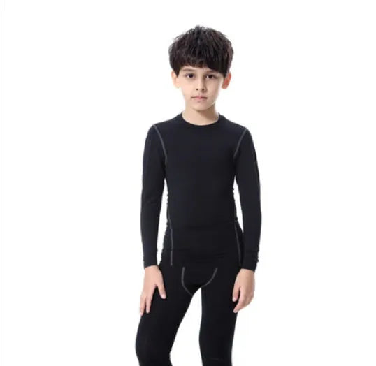 Children's black and green polyester-spandex sportswear set with T-shirt and trousers.