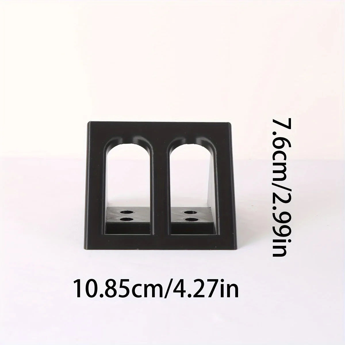 Black plastic punk-style pistol display stand for toy guns.
