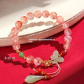 Women's ice floating south red white agate fishtail bracelet showing natural stone colour variation and textured design