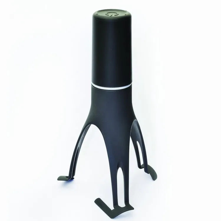 Uutensil Stirr automatic pot mixer device in green colour for hands-free stirring of sauces and soups.