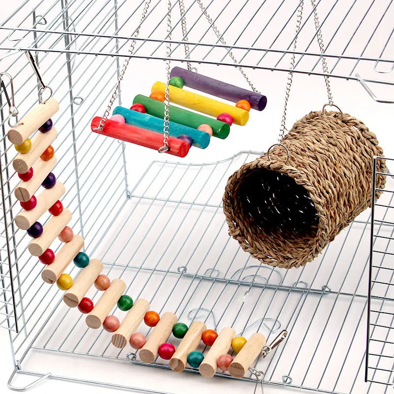 Natural wood small pet toy set with swing, climbing ladder and cotton grass bed on white background