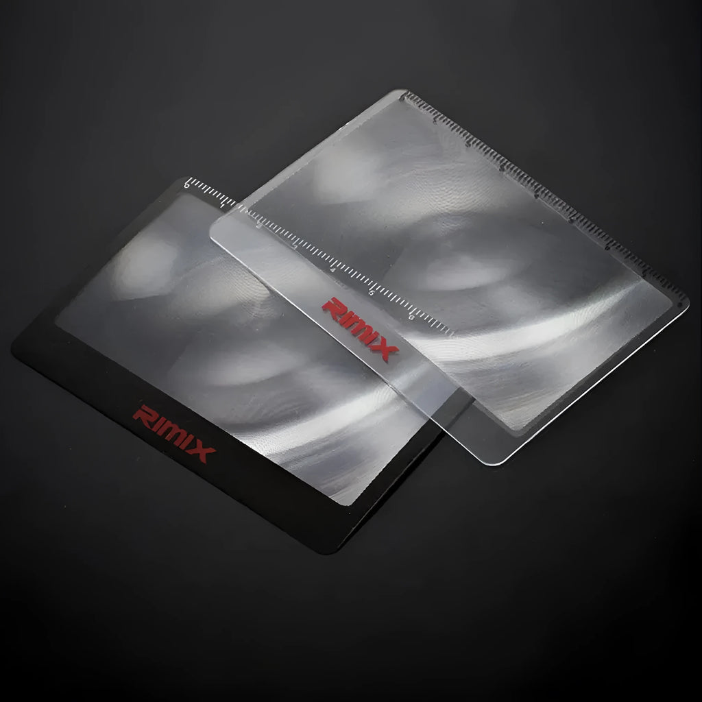 Portable plastic card magnifier for reading small text, shown in black and white colour options