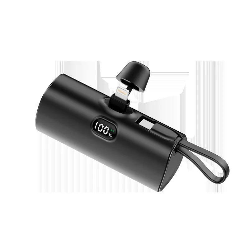 Compact capsule-shaped power bank with digital display and built-in plug in multiple colours.