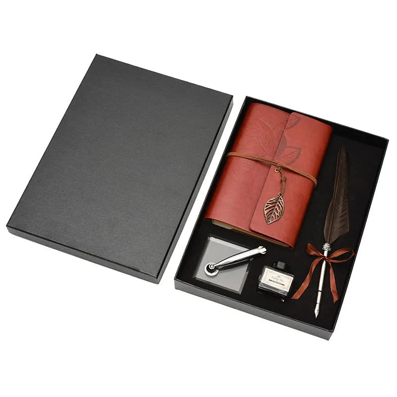 Feather dip pen gift set with copper pen, ink bottle, acrylic base, and antique book in box