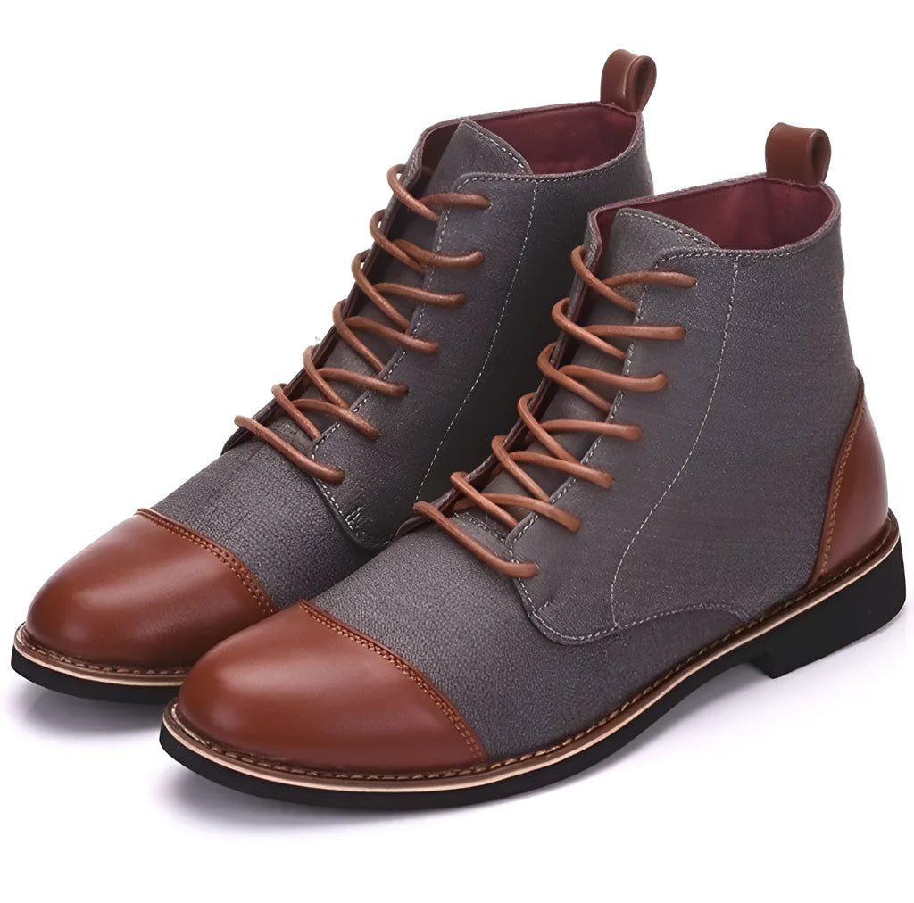 Men's black leather ankle boots with silver buckle strap on side, featuring a thick rubber sole.