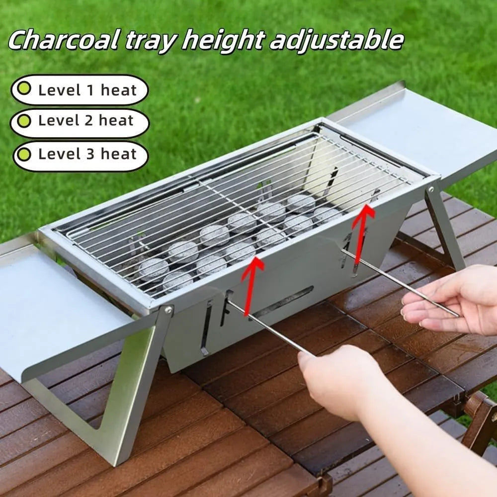 Small collapsible charcoal barbecue grill with folded legs, shown flat-packed.
