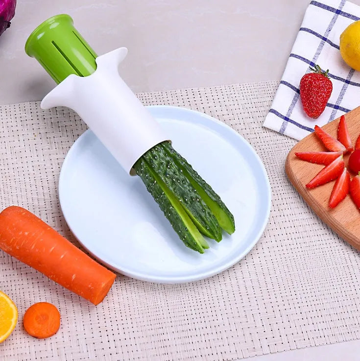 White vegetable cutter tool with six stainless steel blades for slicing cucumbers and carrots
