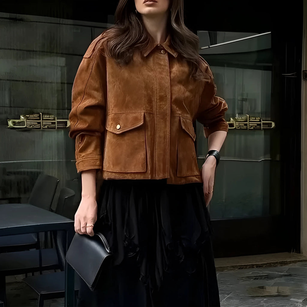 Bright brown suede-effect women's coat with regular sleeves on a hanger