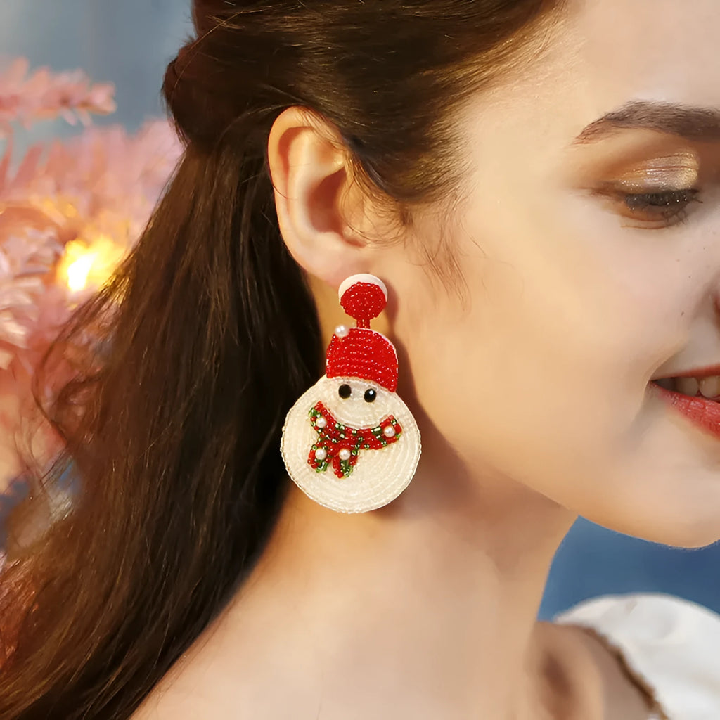 White acrylic snowman bead earrings on a white background, geometric shape, one pair shown