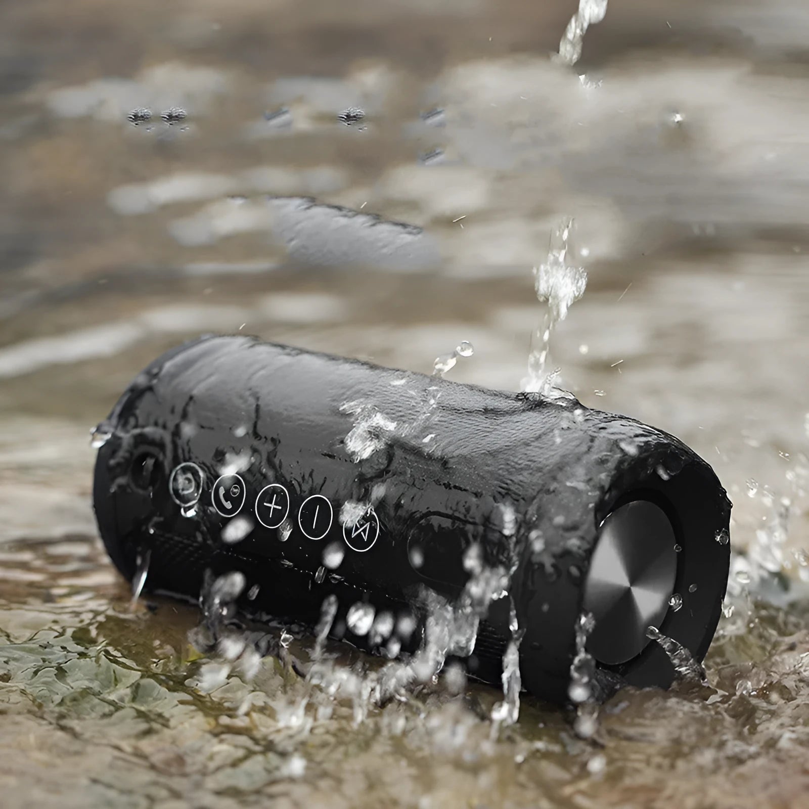 Compact waterproof Bluetooth speaker in camouflage colour, shown outdoors on a rock.