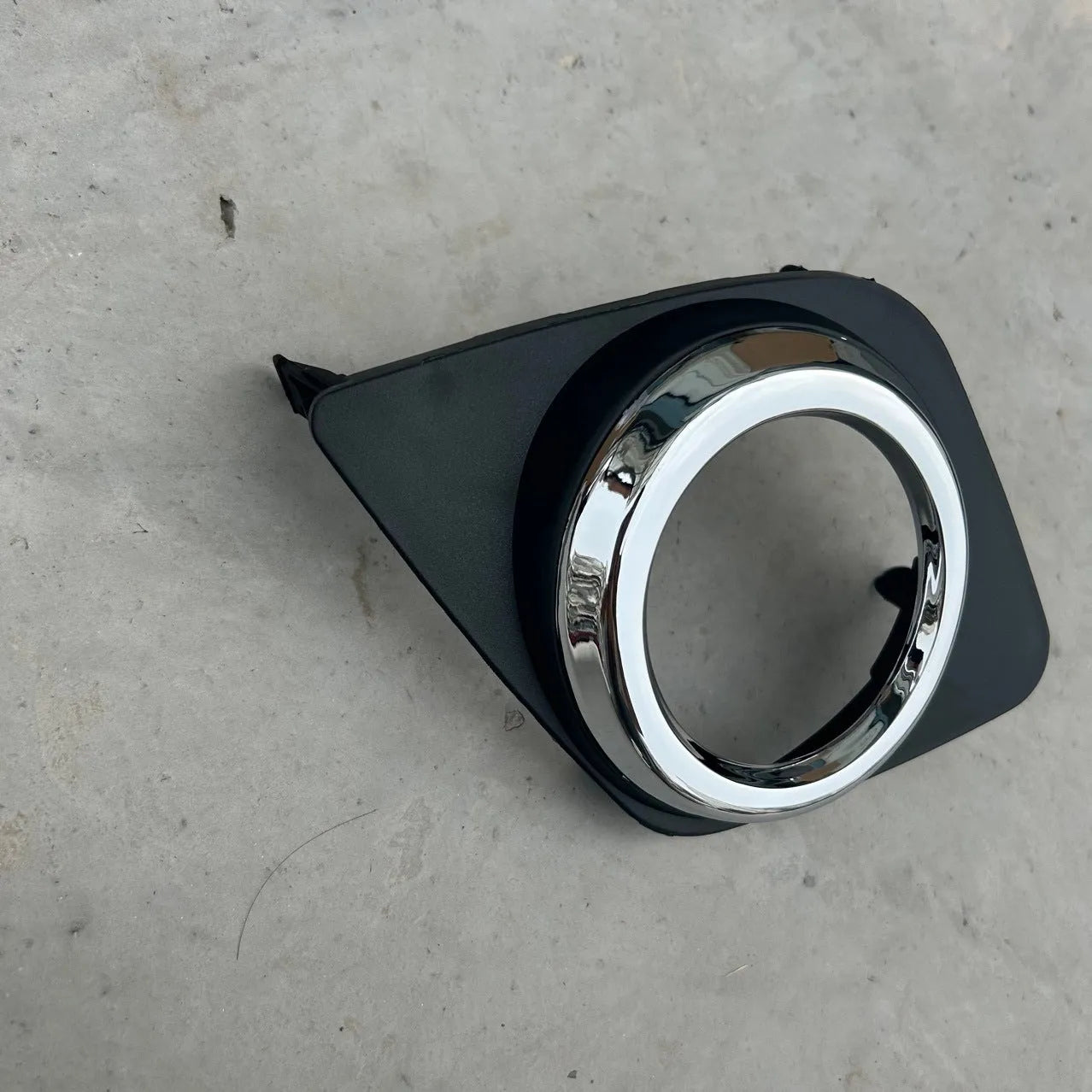 Black Toyota RAV4 front bumper anti-fog light cover for driver or passenger side